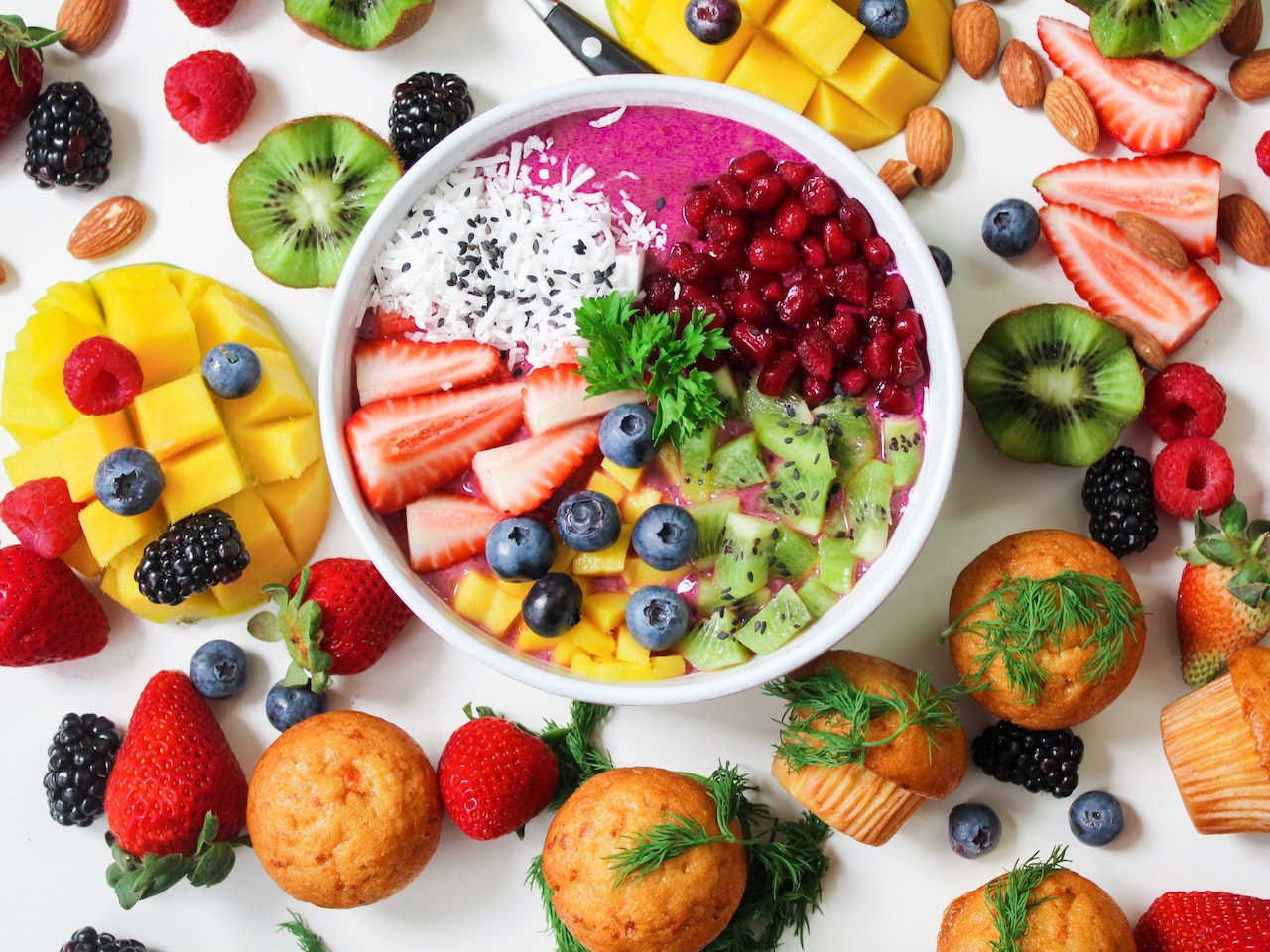 bowl full of different, colorful types of fruit