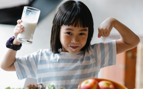 Little girl drinking milk