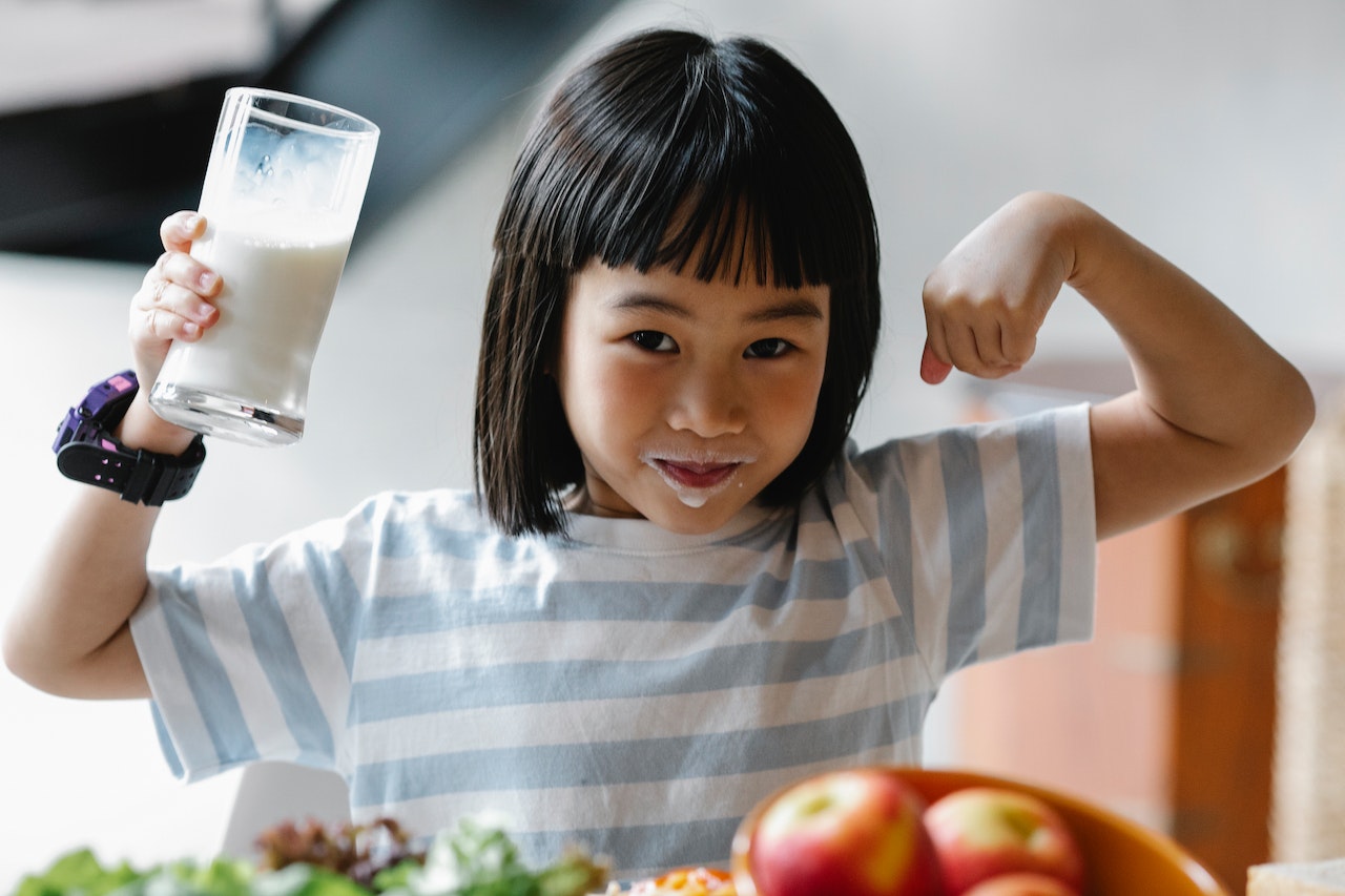 Little girl drinking milk