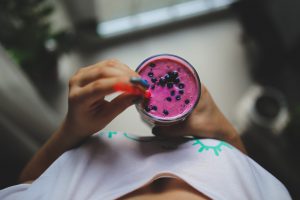 Woman holding smoothie