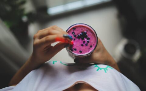 Woman holding smoothie
