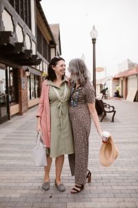 Two women walking down the street together