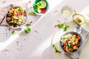 two colorful salads on a table