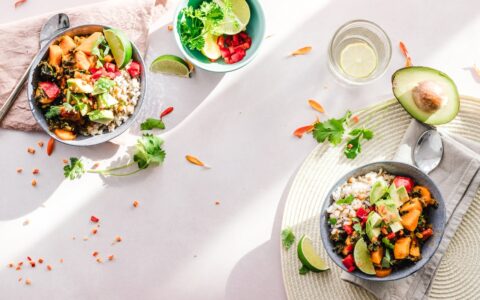two colorful salads on a table