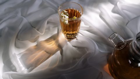 cup of tea on white sheets