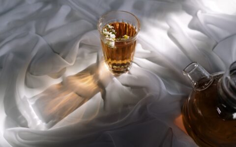 cup of tea on white sheets