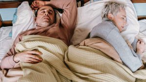 couple sleeping in bed