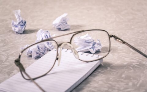 notepad with glasses