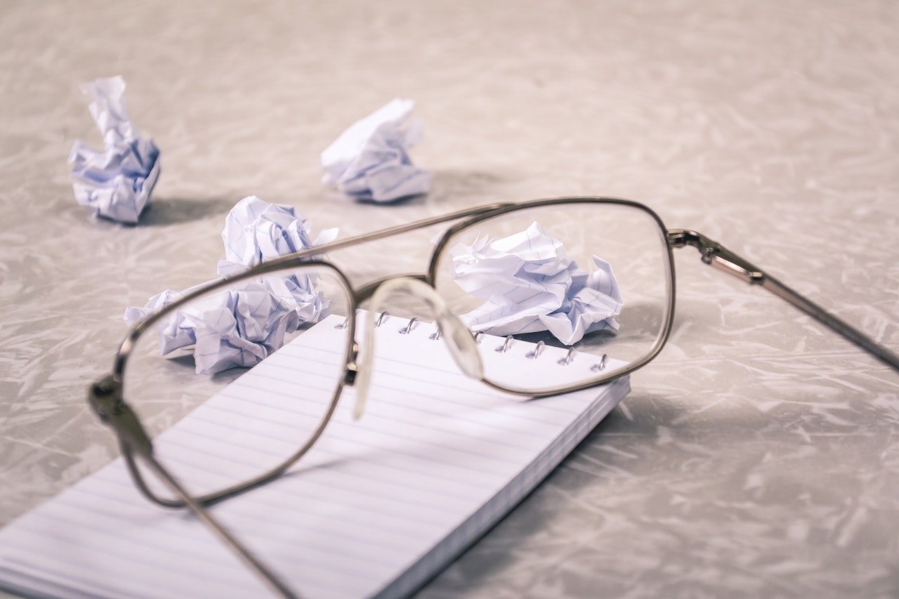 notepad with glasses