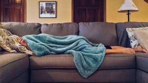 a person sleeping on the couch