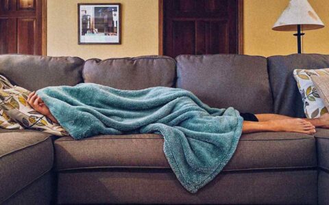 a person sleeping on the couch