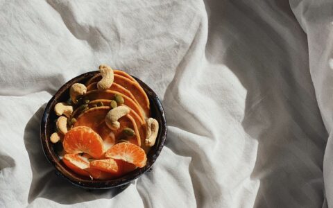 bowl of oranges and nuts