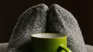 green mug with a blanket