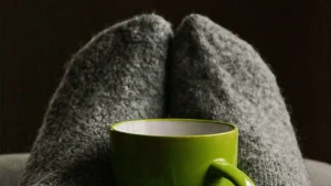 blanket and green mug