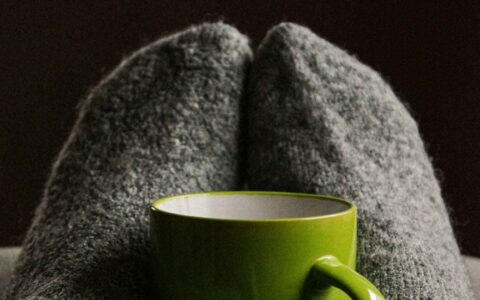 green mug with a blanket