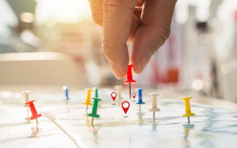 Colorful pushpins on a map
