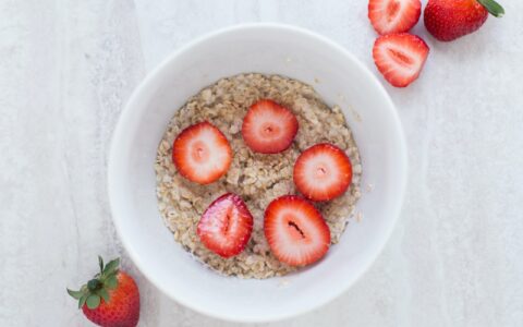 bowl of oatmeal with strawberries