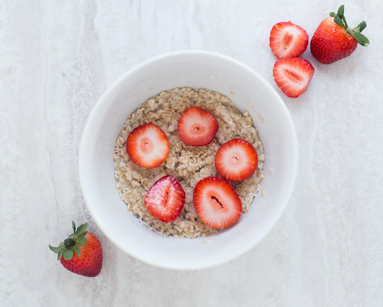 bowl of oatmeal with strawberries