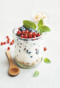 cup of yogurt with fruit on top