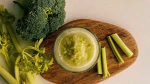 celery and broccoli on cutting board
