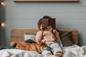 woman reading in bed at night