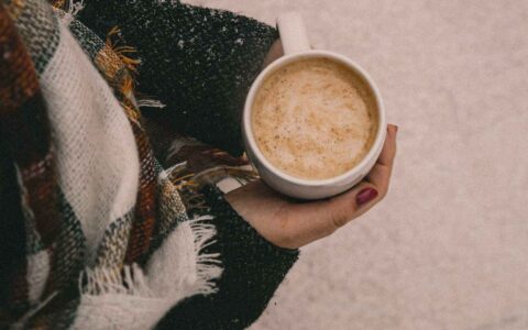 woman holding a cup of coffee