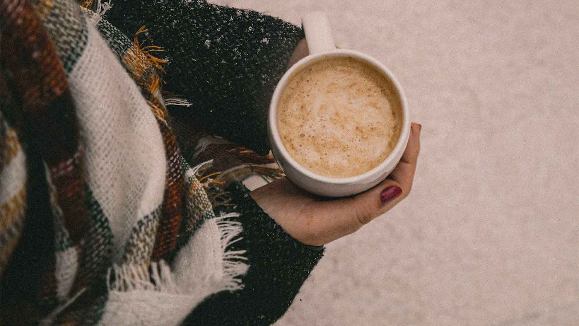 woman holding a cup of coffee