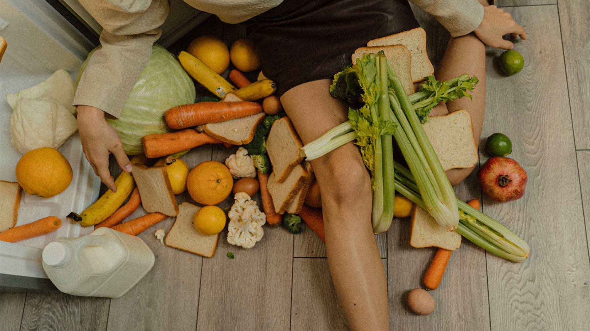 woman sitting with vegetables