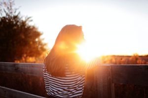 woman standing outside in the sunshine