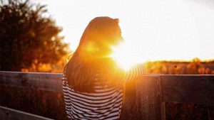 woman with sun shining on her