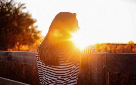woman with sun shining on her