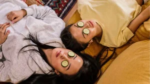 two women with cucumber masks