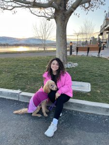 Yaqui sitting with her dog