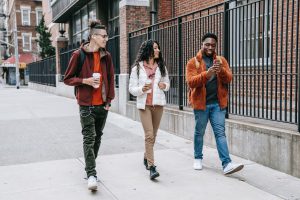 three people walking outside