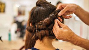 woman getting a hair updo