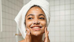 woman washing her face