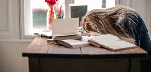 woman sleeping at her desk