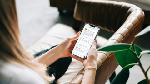 woman holding her phone