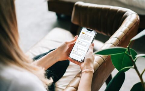 woman holding her phone